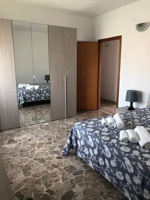 Letto o letti in una camera di Casa Lucia