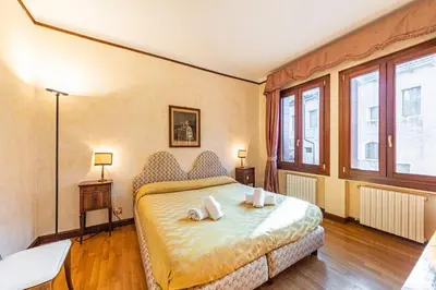 Letto o letti in una camera di Ca' Pellegrini Luxury Grand Canal
