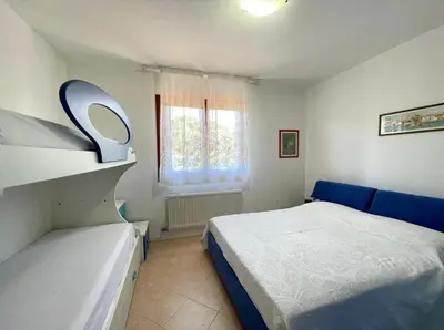 Letto o letti in una camera di Appartamenti Valle Dolce - Carraro Immobiliare - Family Apartments