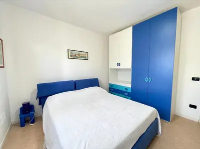 Letto o letti in una camera di Appartamenti Valle Dolce - Carraro Immobiliare - Family Apartments