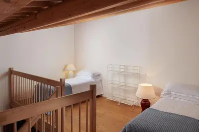 Letto o letti in una camera di Villa Lovi