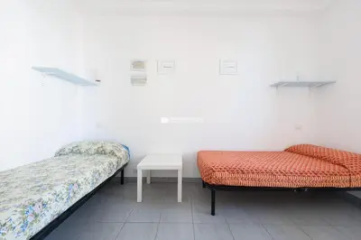 Letto o letti in una camera di Residence Puerto Del Sol Immobiliare Pacella