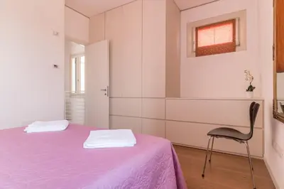 Letto o letti in una camera di Carmini Canal View & Lift by LionHost