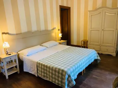 Letto o letti in una camera di B&B Al Ponte
