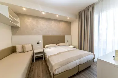 Letto o letti in una camera di Hotel Touring