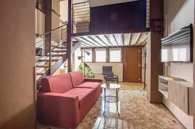Area soggiorno di Madonna Granda Loft by Welc(H)ome