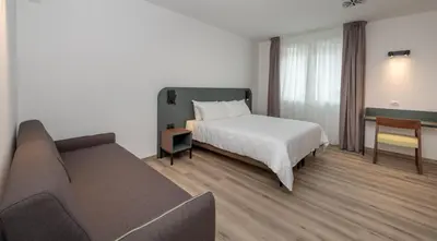 Letto o letti in una camera di Hotel Canton dell'Orto
