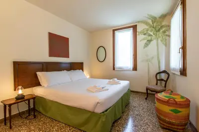 Letto o letti in una camera di Riva De Biasio Charming Apartment