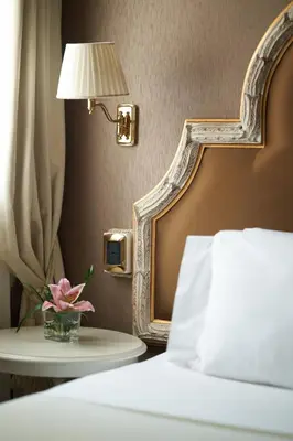 Letto o letti in una camera di Residenza Venezia | UNA Esperienze