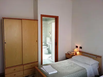Letto o letti in una camera di Hotel Clodia