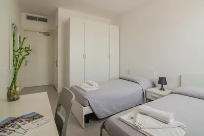 Letto o letti in una camera di Casa Lucia Valentini Terrani