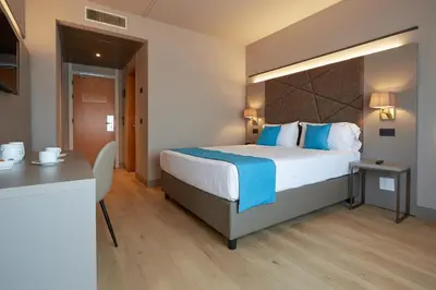 Letto o letti in una camera di DC HOTEL INTERNATIONAL