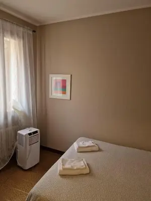 Letto o letti in una camera di San Pietro Apartment