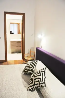 Letto o letti in una camera di Uma Apartments