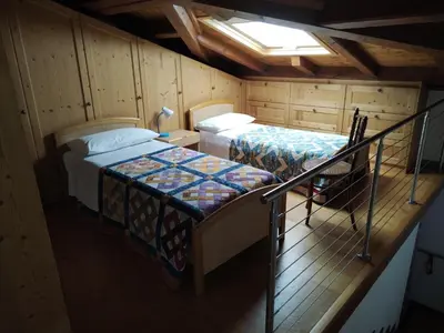 Letto o letti in una camera di Ca' Pinetta