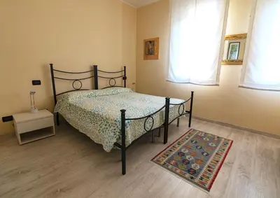 Letto o letti in una camera di B&B Villa Lattes