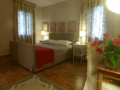 Letto o letti in una camera di La Casa del Giardiniere