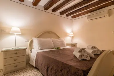 Letto o letti in una camera di SAN MARCO JOY by LionHost
