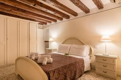 Letto o letti in una camera di SAN MARCO JOY by LionHost