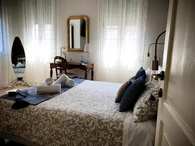 Letto o letti in una camera di Colombo Bed & Breakfast Mestre