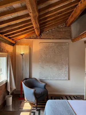 Letto o letti in una camera di Casa Augusta