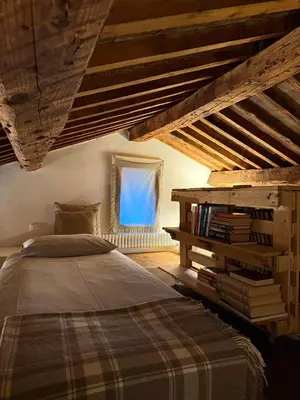 Letto o letti in una camera di Casa Augusta