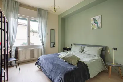 Letto o letti in una camera di Dante7 by Welc(H)ome