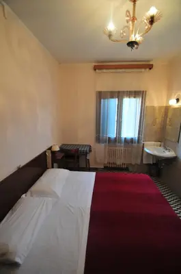 Letto o letti in una camera di Locanda Sant'Anna Hotel