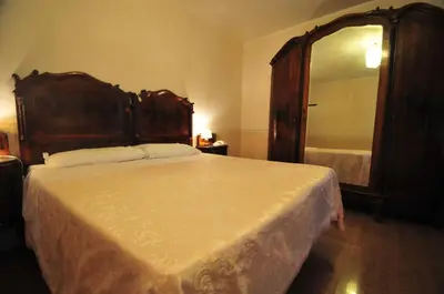 Letto o letti in una camera di Locanda Sant'Anna Hotel