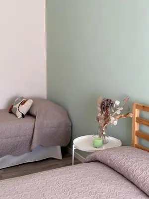 Letto o letti in una camera di Casa TOÈ