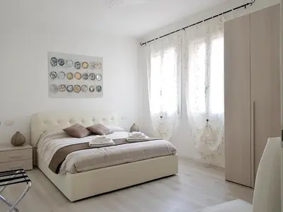 Letto o letti in una camera di Ca' dea Gondoea