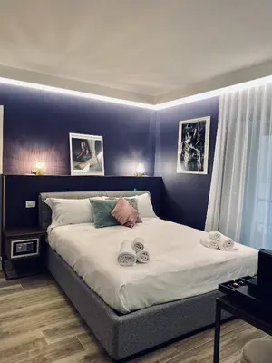 Letto o letti in una camera di Dimora del Teatro
