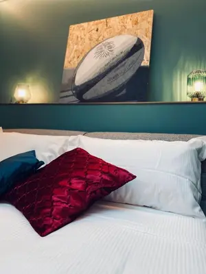Letto o letti in una camera di Dimora del Teatro