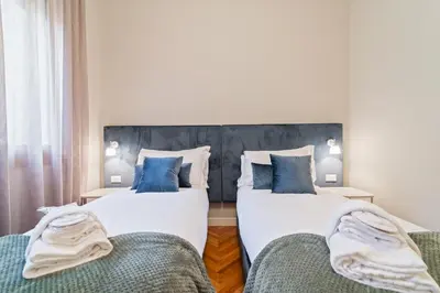 Letto o letti in una camera di GuestHost - San Fermo Luxury Apartment