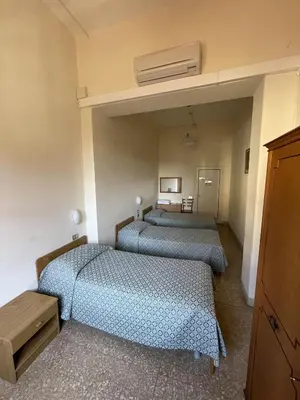 Letto o letti in una camera di Casa Caburlotto