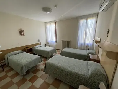 Letto o letti in una camera di Casa Caburlotto
