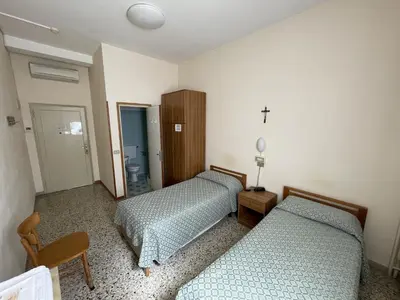 Letto o letti in una camera di Casa Caburlotto