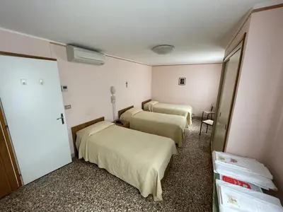 Letto o letti in una camera di Casa Caburlotto