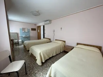 Letto o letti in una camera di Casa Caburlotto