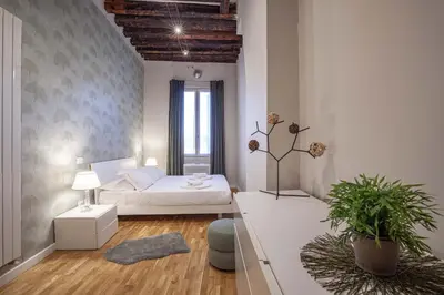 Letto o letti in una camera di San Polo Design Apartments by Wonderful Italy