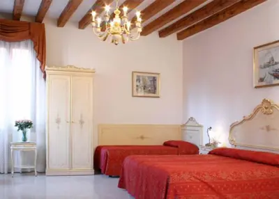Letto o letti in una camera di Hotel Bernardi Semenzato