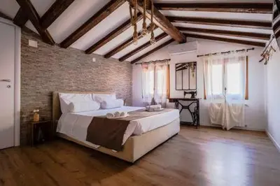 Letto o letti in una camera di Loggia Rialto Apartments