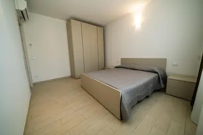Letto o letti in una camera di Sabbia & Mare