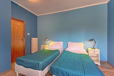 Letto o letti in una camera di Casa alla Corte da Palanca