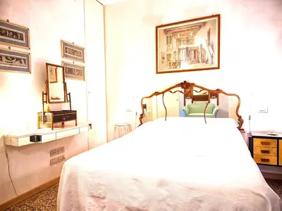 Letto o letti in una camera di Grimaldi Apartments Hermitage Canal Grande view