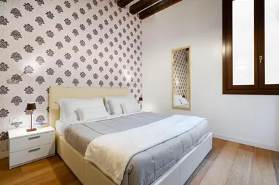 Letto o letti in una camera di Residence Le Beccarie - Rialto by Wonderful Italy