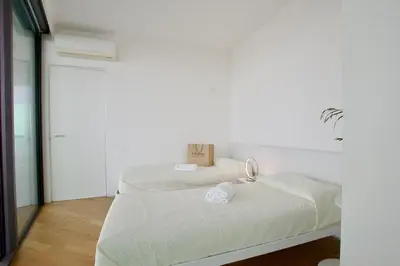 Letto o letti in una camera di Torre Aquileia - Home Immobiliare Jesolo