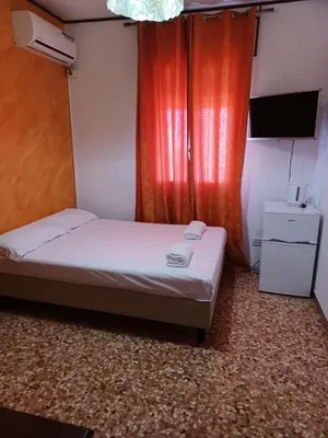 Letto o letti in una camera di C'a Stazione Venezia Mestre