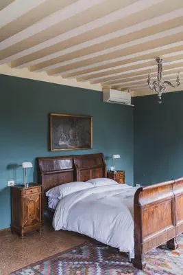 Letto o letti in una camera di Villa Stecchini