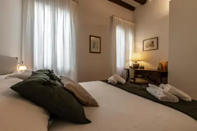 Letto o letti in una camera di Ca' Delle Acque Deluxe Apartment R&R